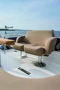 Large tan chair on Norsap seating pedestal on a boat